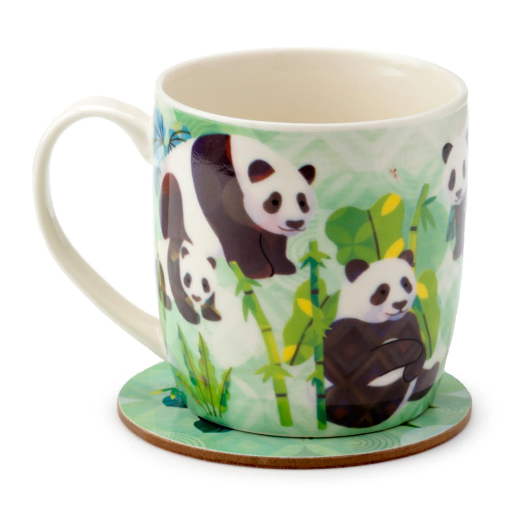Angled view of a porcelain mug and matching round coaster, both in light green with black and white panda illustrations and green bamboo designs. The mug's cream-coloured handle is visible on the left.