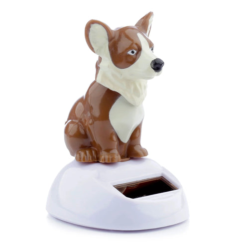 Front-right view of a collectable brown and white Corgi Solar Pal, sitting on a white base with a visible solar panel.