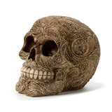 Angled profile view of a beige Damask Skull Ornament, featuring intricate swirling and floral patterns covering its surface. The ornamental figurine has hollow eye sockets and prominent teeth, set against a plain white background.