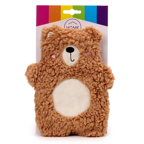Front view of a brown plush teddy bear heat pack, featuring a white muzzle, black embroidered nose and mouth, pink cheeks, and a cream-coloured oval belly patch, displayed on its rainbow-striped and white product packaging with a hang tab.