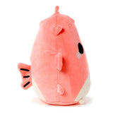 Coral pink and white plush pufferfish toy, angled side view showing its embroidered eyes, fins, and striped tail.