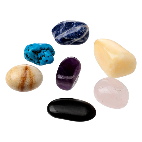 Mini set of 7 tumbled chakra stones, including dark blue, turquoise, dark purple, beige with brown veins, pale yellow, light pink, and black, arranged on a white background.