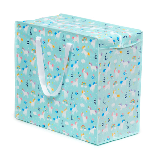 Angled view of a light blue laundry and storage bag with a colourful unicorn, rainbow, and cloud pattern, featuring white webbing handles and a top zip closure.