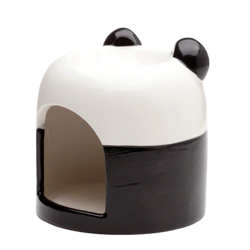 Angled view of a black and white ceramic panda oil burner, featuring a glossy finish, two rounded black ears on top, and an arched opening for a tealight candle.