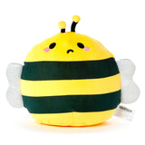 Front view of a round yellow and green striped bee plush toy, with embroidered black eyes, pink cheek spots, a curved black mouth, black antennae with yellow tips, and shimmery silver wings. A white product label hangs from its side.