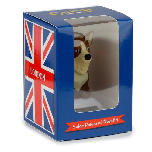 Front-right view of a Collectable Solar Powered Pal Corgi in its blue display box with a clear window, Union Jack flag, 'London' text, and 'Solar Powered Novelty' visible on the packaging.