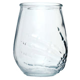 Angled view of a clear glass tumbler featuring an embossed skeleton hand design.