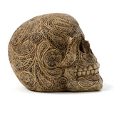 Side view of a cream-coloured Damask Skull Ornament, featuring intricate, embossed patterns and visible teeth.