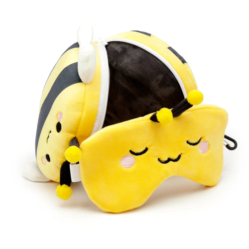 Yellow and black striped bee travel pillow and eye mask set, partially unzipped, featuring embroidered sleeping eyes, pink cheeks, and antennae with yellow pom-poms.