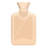 Pale peach rubber hot water bottle with a ribbed texture, shown in a straight-on view revealing embossed compliance standards and material information.