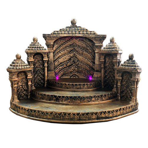 Ornate, temple-like LED display stand in a bronze-gold colour, featuring intricate patterns, tiered platforms, a textured background, and purple lights on the central stage, against a white background.