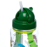 Close-up of a transparent children's water bottle with a dark green lid and a raised white straw. The bottle features colourful dinosaur illustrations and a bright green carry strap is visible on the side.