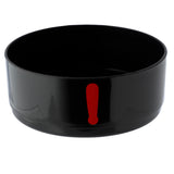 Angled view of a black, round lunch box section, showing its open interior and a bold red exclamation mark graphic on its outer wall.