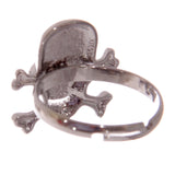 Rear angled view of a dark metallic skull and crossbones mood ring, highlighting the back of the skull design and its adjustable band.