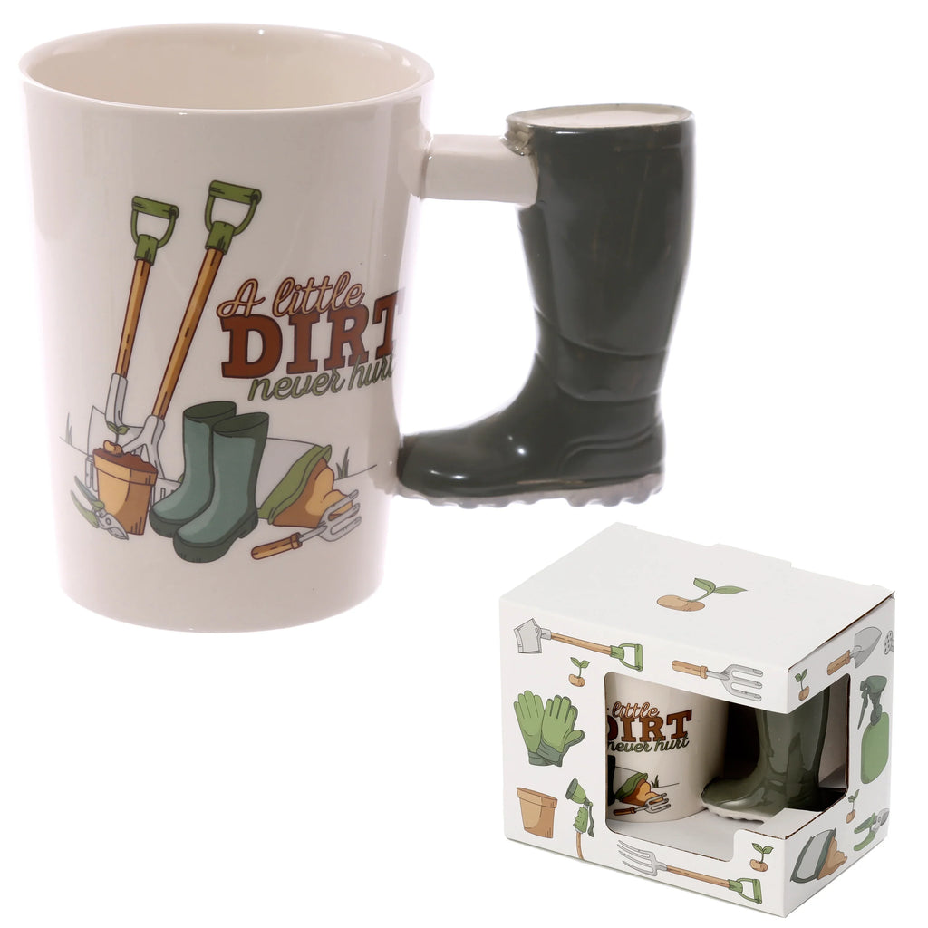 Angled ceramic mug with dark green wellington boot handle, featuring 'A little DIRT never hurt' text and garden tool illustrations, shown with its matching themed gift box.