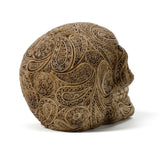 Angled view of a beige Damask Skull Ornament, with intricate raised patterns.