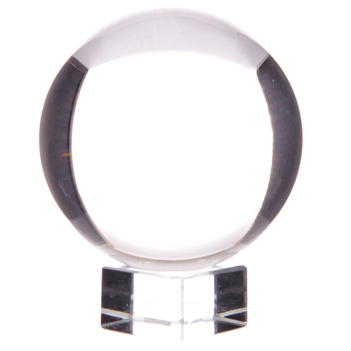 Straight-on view of a clear decorative 7.5cm crystal ball on a transparent square stand.