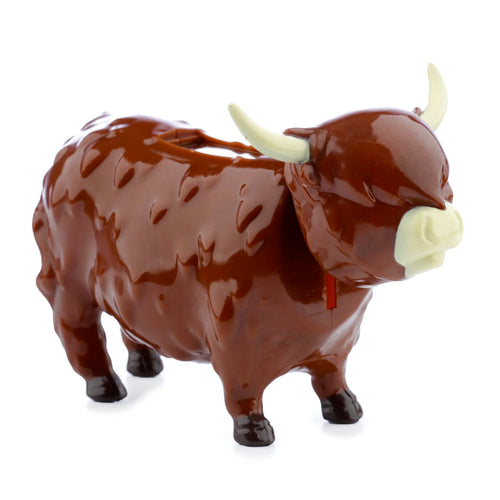 Front-right view of a brown collectable Highland Coo Cow Solar Pal figurine with textured body, cream horns, and snout on white background.
