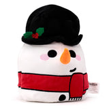Angled front view of a white Christmas festive snowman plush toy with black eyes, orange nose, pink cheeks, wearing a black top hat decorated with green holly and red berries, and a red scarf.
