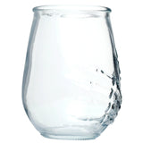A single clear glass tumbler, full height view, showcasing a moulded skeleton hand design on its side, isolated on a white background.