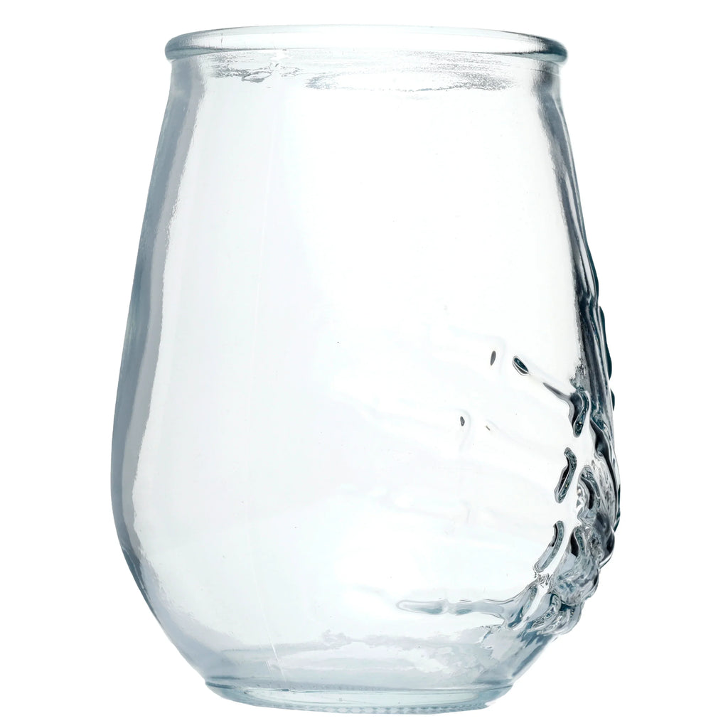 A single clear glass tumbler, full height view, showcasing a moulded skeleton hand design on its side, isolated on a white background.