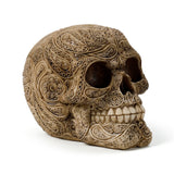 Angled view of a stone-coloured Damask Skull Ornament, intricately detailed with raised swirling patterns and an antiqued finish.