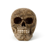 Front view of a beige Damask Skull Ornament, intricately carved with swirling patterns and featuring prominent eye sockets and detailed teeth.
