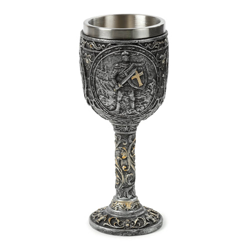 Front view of an ornate silver-coloured decorative goblet, featuring a knight and castle relief design with gold accents.