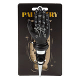 Front view of a novelty black palmistry hand bottle stopper with white astrological symbols, featuring a silver and black rubber base, displayed on black retail packaging.
