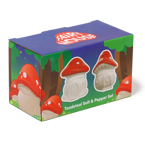 Angled view of the colourful packaging box for a novelty ceramic salt and pepper set. The blue box features illustrations of red and white toadstool houses, trees, and stars, along with text stating 'Fairy House' and 'Toadstool Salt & Pepper Set'.