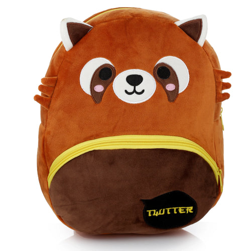 Front view of a plush red panda backpack, featuring brown and white fur, embroidered face details, and a yellow zippered pocket.