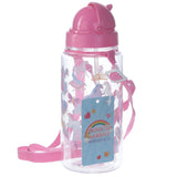 Angled view of a clear children's water bottle, featuring a pink flip-top lid and a pink woven strap. The bottle is adorned with colourful unicorn and fantasy character illustrations. A blue hang tag with a rainbow, heart, and star motif is attached.