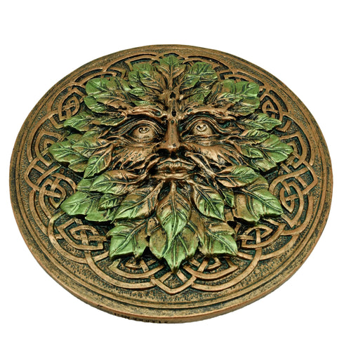 Top view of a round Greenman ashcatcher incense burner, featuring a face sculpted from green leaves on a bronze-toned base with intricate Celtic knotwork.