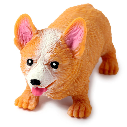 Angled view of a textured orange and white Corgi stretchy toy, featuring black eyes, pink ears, and a pink tongue, on a white background.