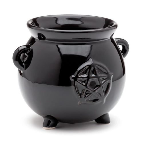 Front view of a glossy black ceramic indoor planter, shaped like a witch's cauldron, with an embossed pentagram design, two loop handles, and three feet, on a white background.
