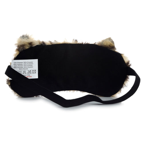 Back view of a plush leopard eye mask, featuring a black lining, elastic strap, and a visible care label.