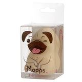 Angled view of a beige makeup beauty blender applicator sponge in clear packaging, featuring a cartoon pug design with brown ears and pink tongue, plus 'Mopps Makeup Sponge' text.
