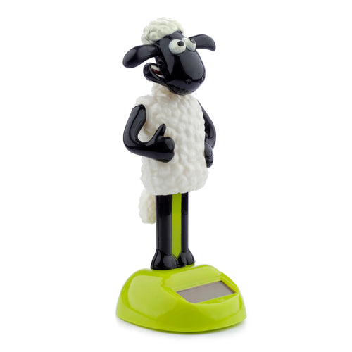 Front view of a collectable, licensed Shaun the Sheep solar pal figurine. The black and white sheep stands on a lime green base with a visible solar panel, giving a thumbs up gesture.