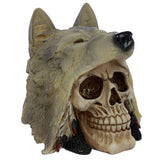 Angled view of a fantasy skull ornament. The beige skull, featuring detailed teeth and empty eye sockets, is depicted wearing a textured grey wolf's head with a black snout and prominent ears. Red and black feather details are visible at the sides.