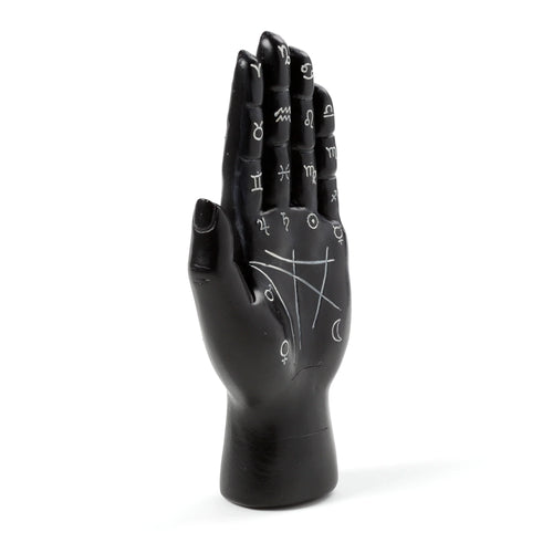 Front view of a black decorative hand ornament featuring white astrological and palmistry symbols on its palm.
