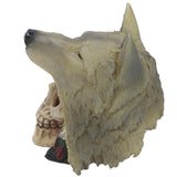 Angled view of a fantasy skull with wolf head ornament, showing textured grey and beige fur over a cream-coloured skull.