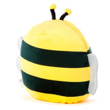 Angled view of a fluffy yellow and black striped plush bee toy, featuring two black antennae with yellow tips and sparkling silver wings.