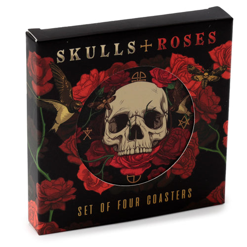Angled view of a black box for a set of four novelty coasters. The box features a 'Skulls + Roses' design with red roses, skulls, birds, and moths, and has a circular cut-out revealing a coaster with a skull graphic.