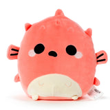 Front view of a coral pink Squidglys pufferfish plush toy, with black embroidered eyes, a small black mouth, and a cream-coloured belly, on a white background.