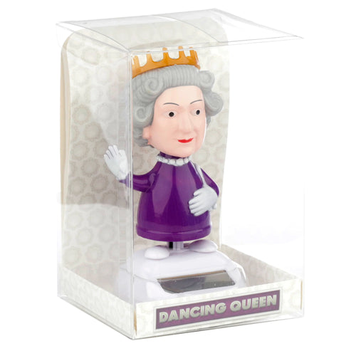 Front view of a novelty Dancing Queen solar pal, depicting a queen figure with grey hair, gold crown, purple dress, and pearl necklace. The figurine is displayed in a clear plastic box, with the solar panel and 'Dancing Queen' text visible on its white base.