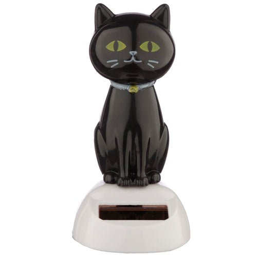 Front view of a black cat solar pal figurine with green eyes and a light blue collared bell, sitting on a white base with a visible solar panel.